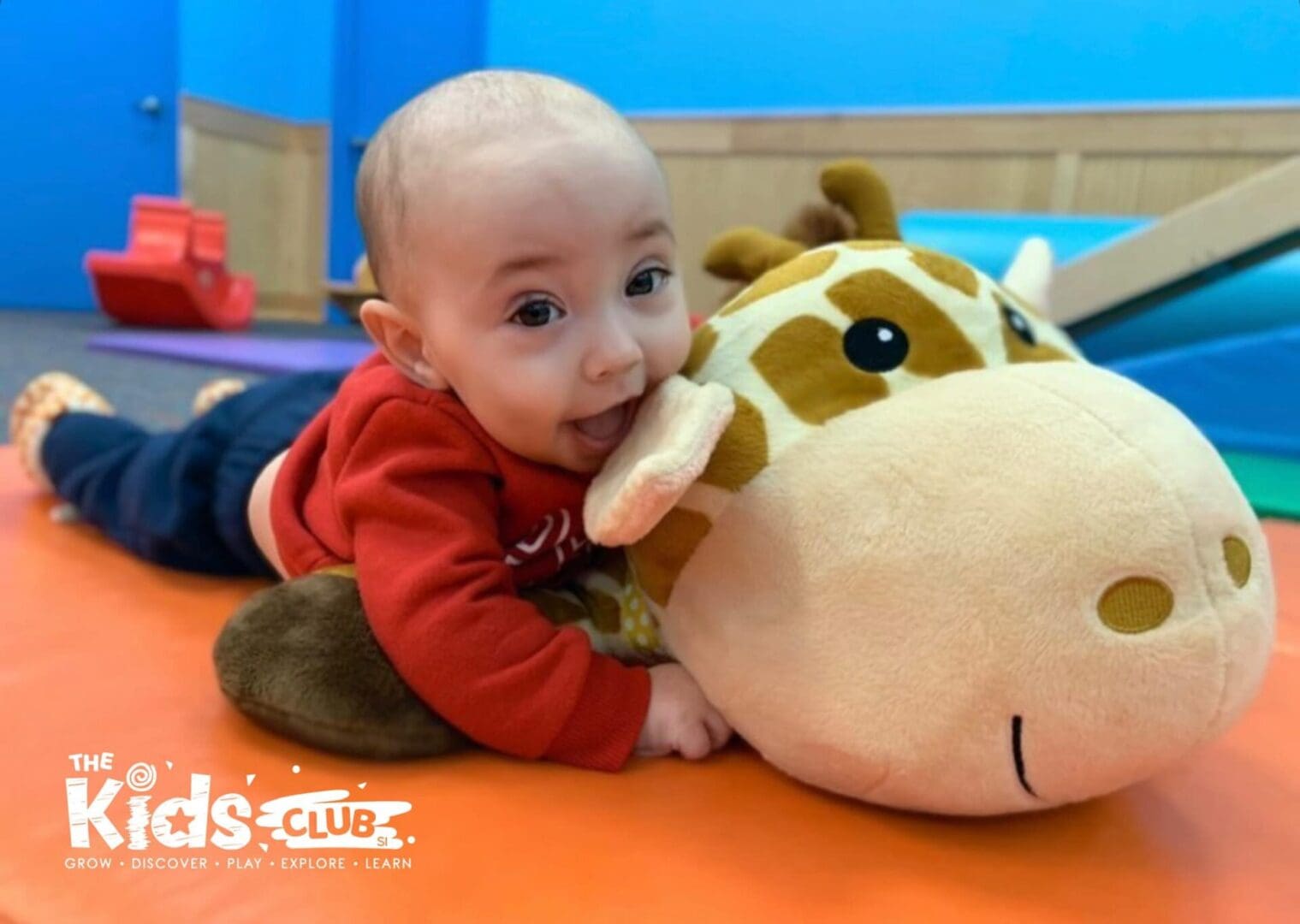 Baby enjoying himself at mommy and me on Jax the Giraffe: The official mascot of The Kids Club of SI